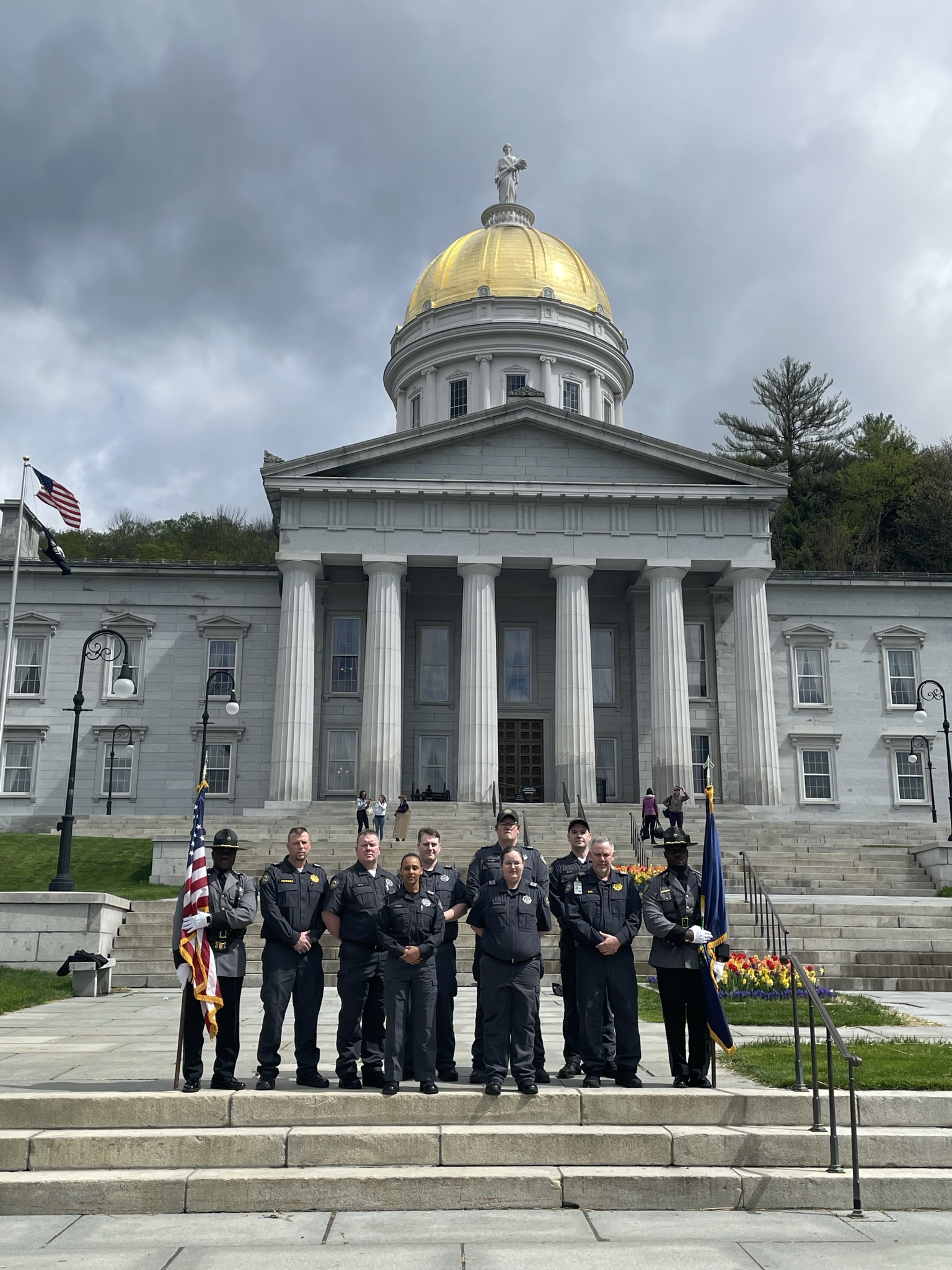 Photo of corrections staff outside the Vermont Statehouse.