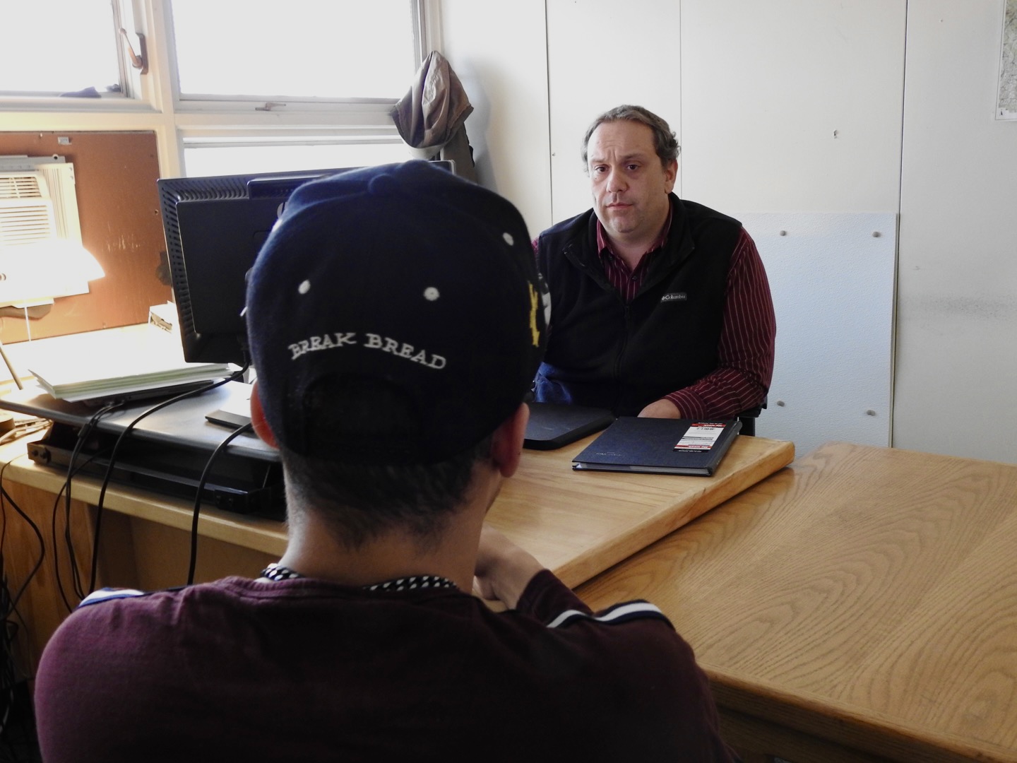 Photo of Probation & Parole Officer speaking with a supervised individual.